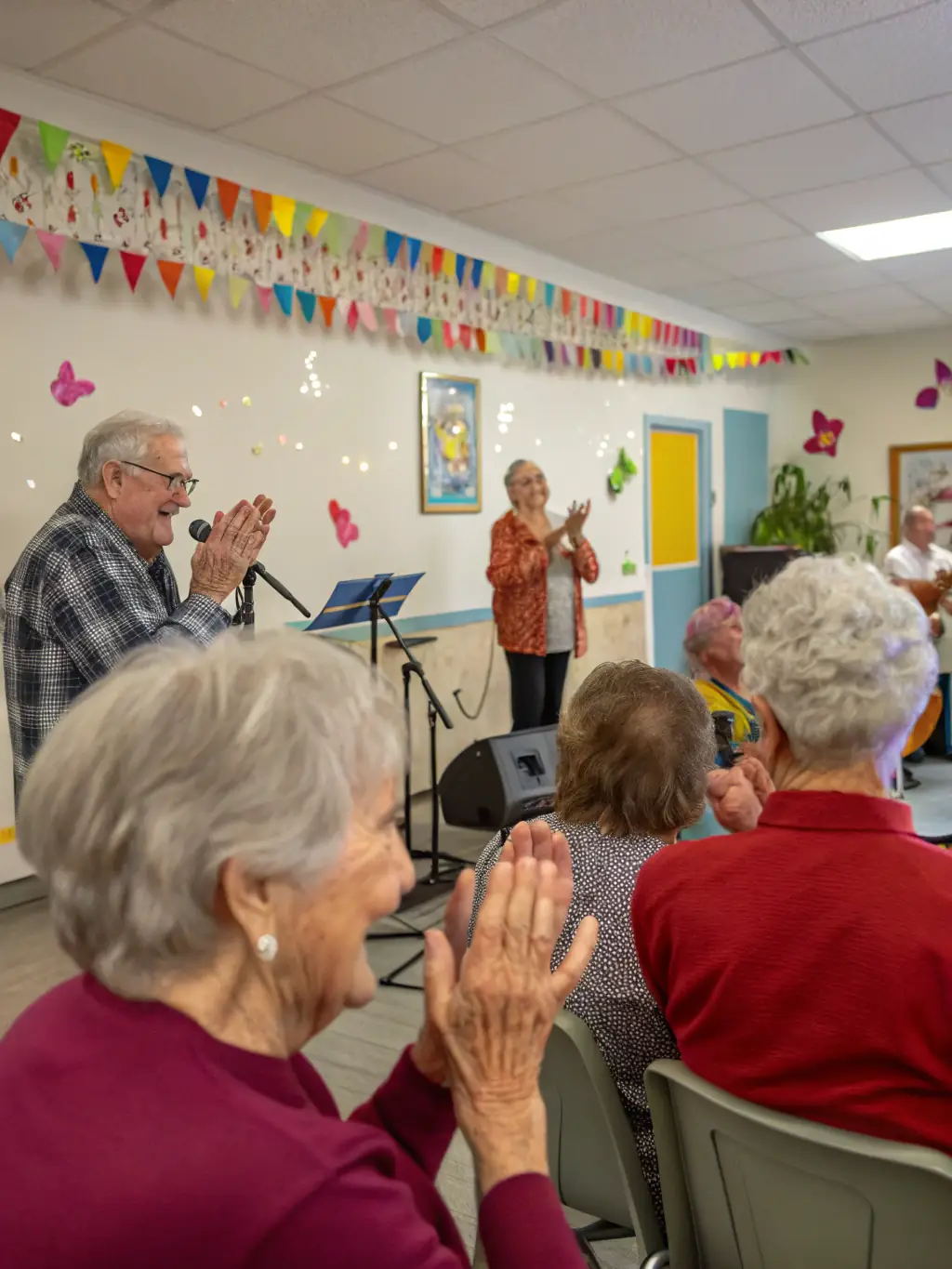 Patients attending a cultural event organized by the library, such as a musical performance or art exhibition, enriching their hospital experience.