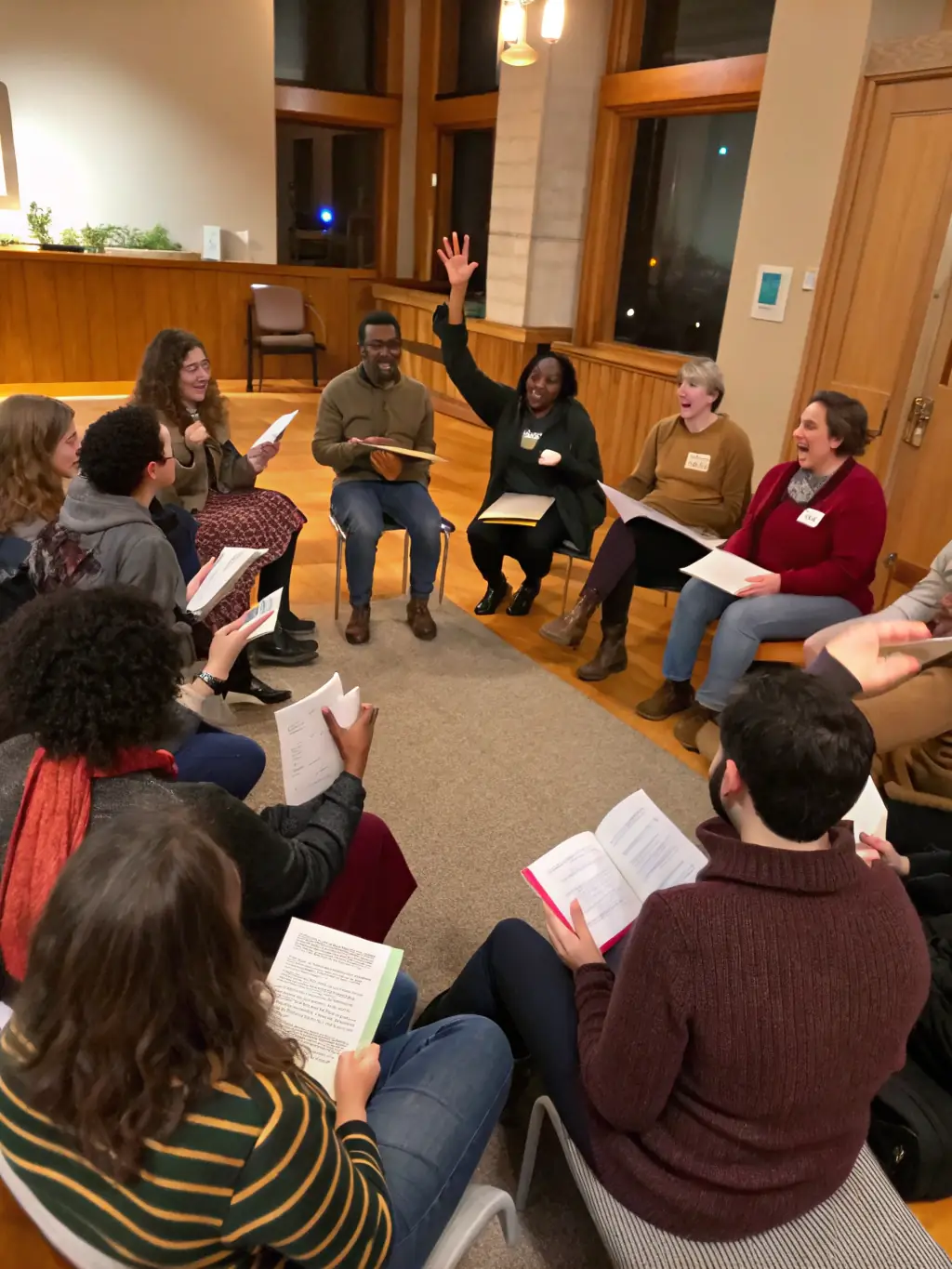 A group of patients participating in a guided reading session in the hospital library, with a facilitator leading the discussion and providing support.